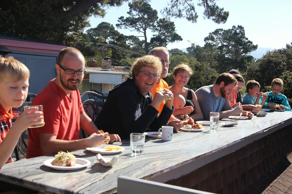 The Holzmann family sharing a meal together